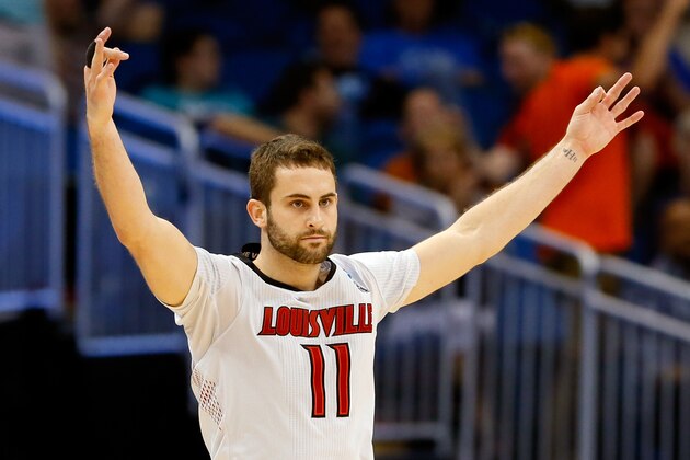 ORLANDO, FL - MARCH 20:  Luke Hancock #11 of the Louisville Cardinals celebrates after his second three point in the second half against the Manhattan Jaspers during the second round of the 2014 NCAA Men's Basketball Tournament at Amway Center on March 20, 2014 in Orlando, Florida.  (Photo by Kevin C. Cox/Getty Images)