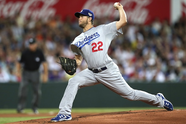 The Dodgers' Clayton Kershaw throws his first pitch of the Major League Baseball 2014 season during the opening game between the Los Angeles Dodgers and Arizona Diamondbacks at the Sydney Cricket ground in Sydney, Saturday, March 22, 2014.  (AP Photo/Rick Rycroft)