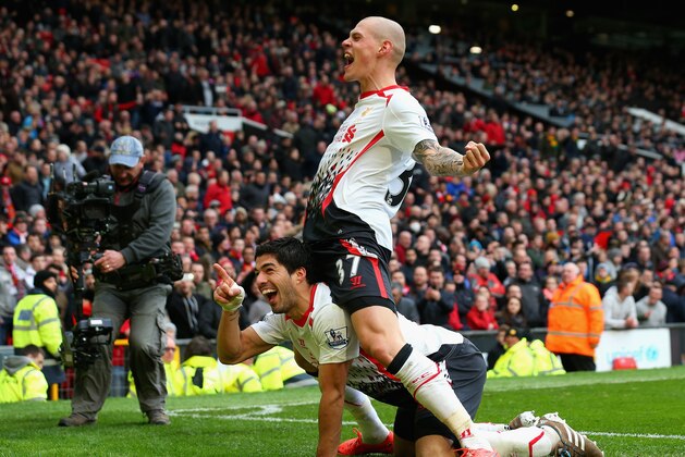 MANCHESTER, ENGLAND - MARCH 16:  Luis Suarez of Liverpool celebrates scoring his team's third goal with Martin Skrtel (R) during the Barclays Premier League match between Manchester United and Liverpool at Old Trafford on March 16, 2014 in Manchester, England.  (Photo by Alex Livesey/Getty Images)