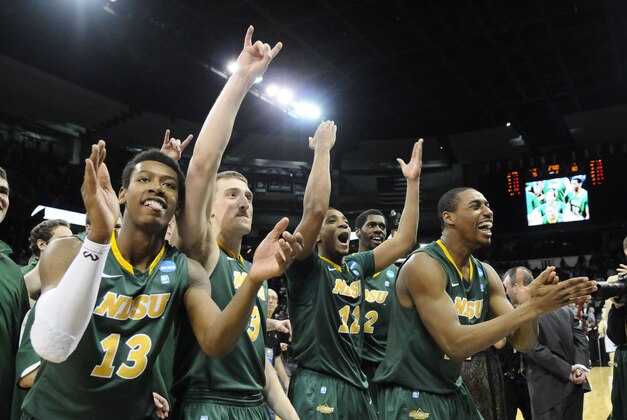 Mar 20, 2014; Spokane, WA, USA; North Dakota State Bison guard Carlin Dupree (13), guard Mike Felt (3), guard Lawrence Alexander (12), and guard Kory Brown (22) celebrate after overtime a men's college basketball game during the second round of the 2014 NCAA Tournament against the Oklahoma Sooners at Veterans Memorial Arena. The Bison defeated the Sooners 80-75. Mandatory Credit: James Snook-USA TODAY Sports