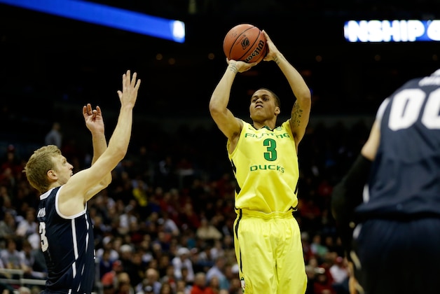 Mar 20, 2014; Milwaukee, WI, USA; Oregon Ducks guard Joseph Young (3) shoots a jump shot over Brigham Young Cougars guard Tyler Haws (3) during the second round of the 2014 NCAA Tournament at BMO Harris Bradley Center. Mandatory Credit: Jeff Hanisch-USA TODAY Sports Mar 20, 2014; Milwaukee, WI, USA; Oregon Ducks guard Joseph Young (3) shoots a jump shot over Brigham Young Cougars guard Tyler Haws (3) during the second round of the 2014 NCAA Tournament at BMO Harris Bradley Center. Mandatory Credit: Jeff Hanisch-USA TODAY Sports