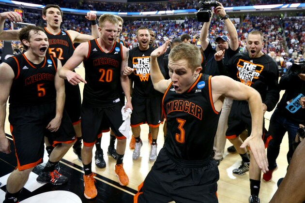 RALEIGH, NC - MARCH 21:  Kevin Canevari #3 of the Mercer Bears celebrates with teammates after defeating the Duke Blue Devils 78-71 in the second round of the 2014 NCAA Men's Basketball Tournament at PNC Arena on March 21, 2014 in Raleigh, North Carolina.  (Photo by Streeter Lecka/Getty Images)