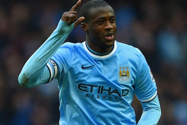 MANCHESTER, ENGLAND - MARCH 22:  Yaya Toure of Manchester City celebrates scoring his hat trick  during the Barclays Premier League match between Manchester City and Fulham at Etihad Stadium on March 22, 2014 in Manchester, England.  (Photo by Michael Regan/Getty Images)