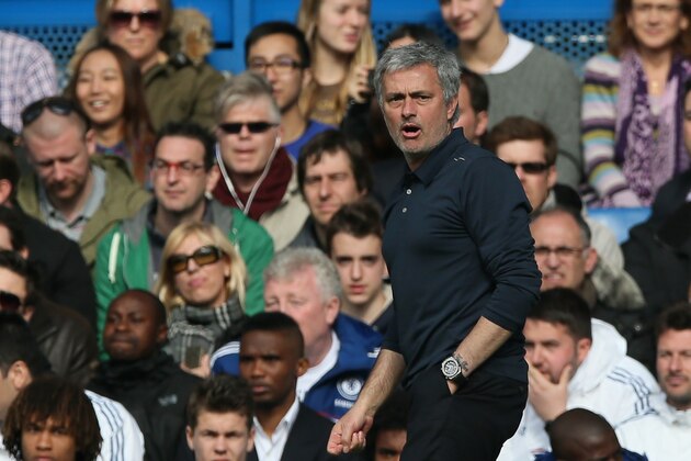 Chelsea's manager Jose Mourinho watches his team play during their English Premier League soccer match between Chelsea and Arsenal at Stamford Bridge stadium in London, Saturday, March  22, 2014. (AP Photo/Alastair Grant)