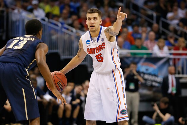 ORLANDO, FL - MARCH 22:  Scottie Wilbekin #5 of the Florida Gators calls a play in the second half against Josh Newkirk #13 of the Pittsburgh Panthers during the third round of the 2014 NCAA Men's Basketball Tournament at Amway Center on March 22, 2014 in Orlando, Florida.  (Photo by Kevin C. Cox/Getty Images)