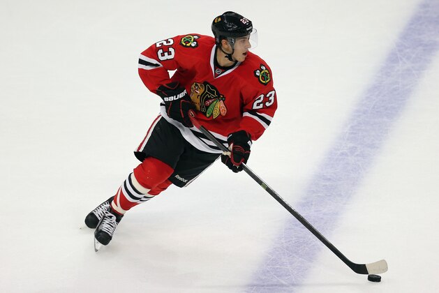 CHICAGO, IL - SEPTEMBER 19:  Teuvo Teravainen #23 of the Chicago Blackhawks advances the puck against the Pittsburgh Penguins during an exhibition game at United Center on September 19, 2013 in Chicago, Illinois. The Penguins defeated the Blackhawks 4-3 in a shootout.  (Photo by Jonathan Daniel/Getty Images)