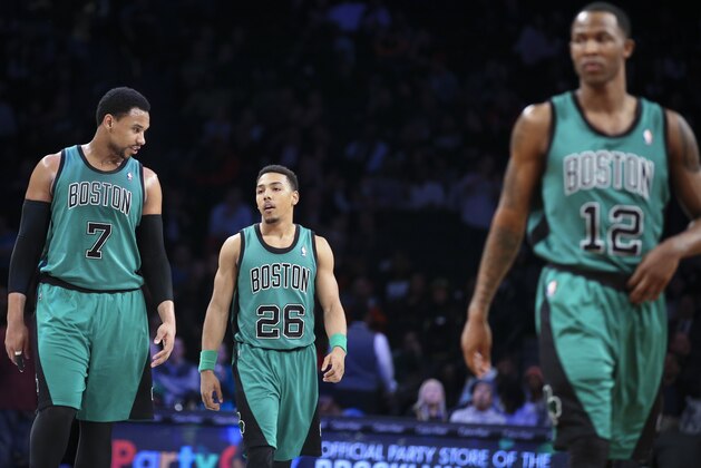 Boston Celtics guard Phil Pressey (26), center Jared Sullinger (7), and forward Chris Johnson (12) react as they take the court during the second half of an NBA basketball game against the Brooklyn Nets at the Barclays Center, Friday, March 21, 2014, in New York. The Nets defeated the Celtics, 114-98. (AP Photo/John Minchillo)