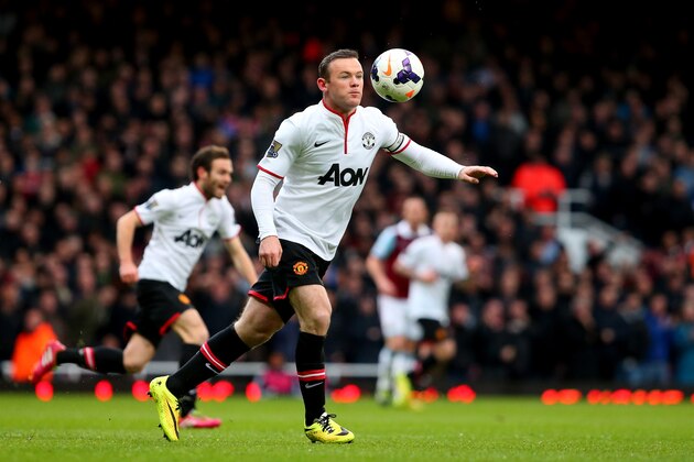 LONDON, ENGLAND - MARCH 22:  Wayne Rooney of Manchester United scores the opening goal with a long range shot during the Barclays Premier League match between West Ham United and Manchester United at Boleyn Ground on March 22, 2014 in London, England.  (Photo by Julian Finney/Getty Images)