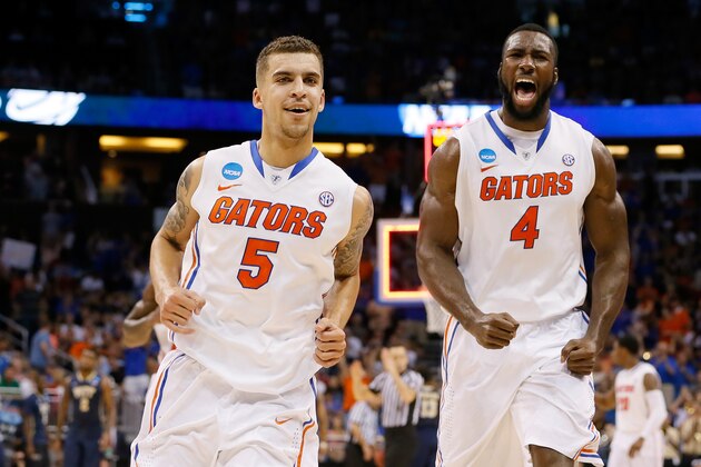 ORLANDO, FL - MARCH 22:  Scottie Wilbekin #5 and Patric Young #4 of the Florida Gators celebrate after Wilbekin makes a three-pointer to end the first half against the Pittsburgh Panthers during the third round of the 2014 NCAA Men's Basketball Tournament at Amway Center on March 22, 2014 in Orlando, Florida.  (Photo by Kevin C. Cox/Getty Images)