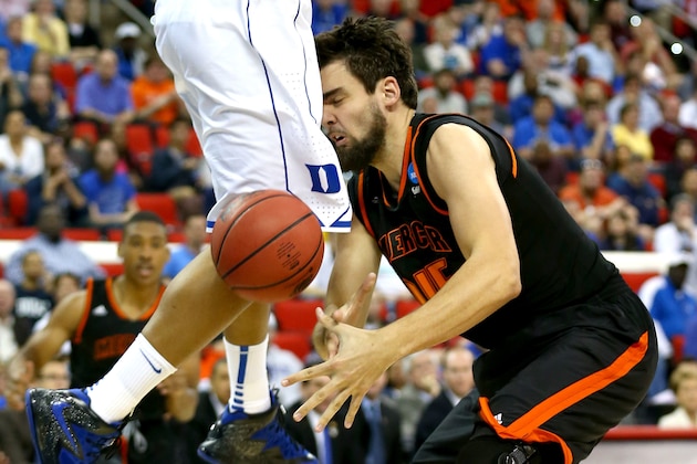 RALEIGH, NC - MARCH 21: Monty Brown #45 of the Mercer Bears is hit in the head by the knee of Jabari Parker #1 of the Duke Blue Devils in the first half in the second round of the 2014 NCAA Men's Basketball Tournament at PNC Arena on March 21, 2014 in Raleigh, North Carolina. (Photo by Streeter Lecka/Getty Images) RALEIGH, NC - MARCH 21: Monty Brown #45 of the Mercer Bears is hit in the head by the knee of Jabari Parker #1 of the Duke Blue Devils in the first half in the second round of the 2014 NCAA Men's Basketball Tournament at PNC Arena on March 21, 2014 in Raleigh, North Carolina. (Photo by Streeter Lecka/Getty Images)