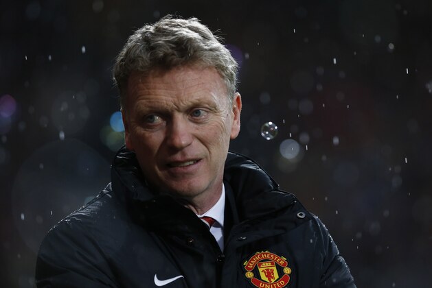 Manchester United's manager David Moyes looks on from the dugout before the start of their English Premier League soccer match against West Ham United at Upton Park, London, Saturday, March 22, 2014. (AP Photo/Sang Tan)