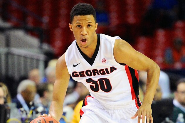 Mar 14, 2014; Atlanta, GA, USA; Georgia Bulldogs guard J.J. Frazier (30) brings the ball up court against the Mississippi Rebels during the first half in the quarterfinals of the SEC college basketball tournament at Georgia Dome. Mandatory Credit: Dale Zanine-USA TODAY Sports