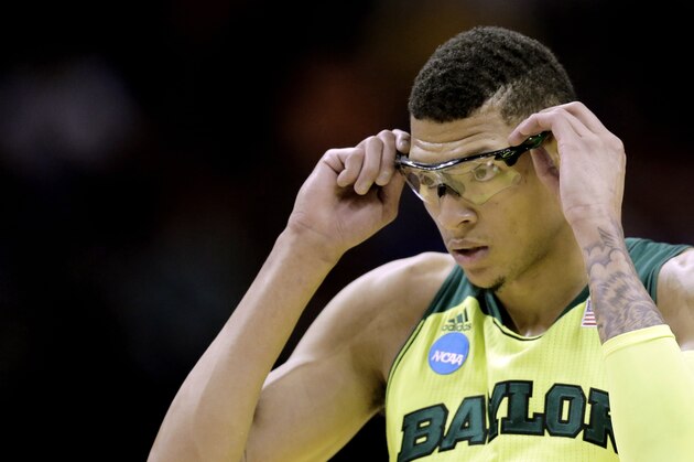 Baylor's Isaiah Austin adjusts his glasses during the first half of a second-round game against Nebraska in the NCAA college basketball tournament Friday, March 21, 2014, in San Antonio. (AP Photo/Eric Gay)