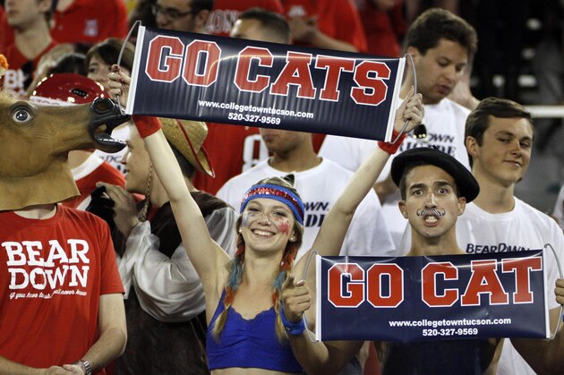 Arizona Wildcat fans show their spirit against Utah in the first half of an NCAA college football game, Saturday, Oct. 19, 2013 in Tucson, Ariz.  Arizona won 35 - 24. (AP Photo/Wily Low)