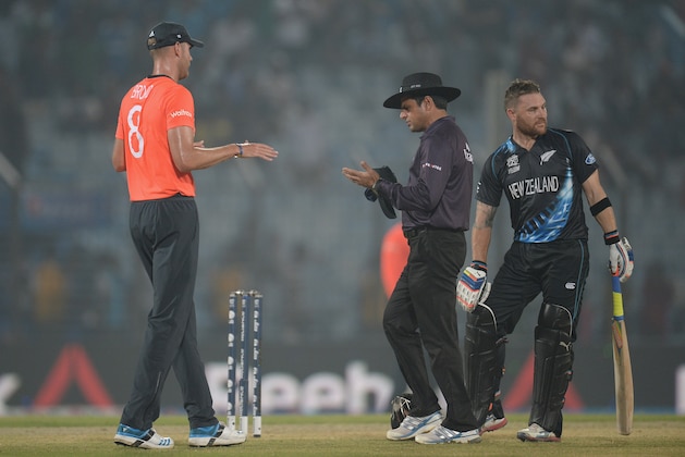 CHITTAGONG, BANGLADESH - MARCH 22:  England captain Stuart Broad speaks with umpire Aleem Dar and Brendon McCullum of New Zealand before the game is stopped for rain during the ICC World Twenty20 Bangladesh 2014 group 1 match between England and New Zealand at Zahur Ahmed Chowdhury Stadium on March 22, 2014 in Chittagong, Bangladesh.  (Photo by Gareth Copley/Getty Images)