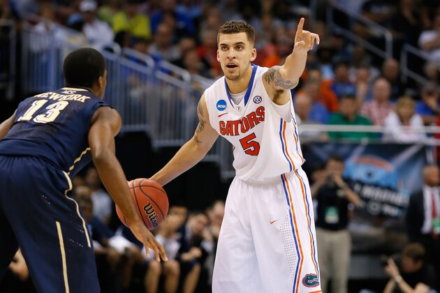 ORLANDO, FL - MARCH 22:  Scottie Wilbekin #5 of the Florida Gators calls a play in the second half against Josh Newkirk #13 of the Pittsburgh Panthers during the third round of the 2014 NCAA Men's Basketball Tournament at Amway Center on March 22, 2014 in Orlando, Florida.  (Photo by Kevin C. Cox/Getty Images)