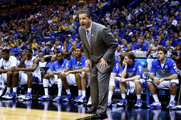 ST LOUIS, MO - MARCH 21:  Head coach John Calipari of the Kentucky Wildcats speaks to his players during the second round of the 2014 NCAA Men's Basketball Tournament against the Kansas State Wildcats at the Scottrade Center on March 21, 2014 in St Louis, Missouri.  (Photo by Andy Lyons/Getty Images)