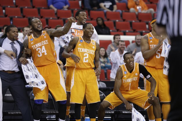 Tennessee's players Jeronne Maymon, Antonio Barton and Josh Richardson, from left, celebrate after the second half of an NCAA college basketball second-round tournament game against Massachusetts, Friday, March 21, 2014, in Raleigh, N.C. Tennessee won 86-67. (AP Photo/Chuck Burton)