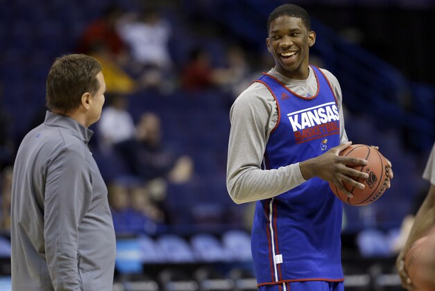 Kansas' Joel Embiid, right, talks with head coach Bill Self during practice for the NCAA college basketball tournament Thursday, March 20, 2014, in St. Louis. Kansas is scheduled to play Eastern Kentucky in a second-round game on Friday. (AP Photo/Jeff Roberson)