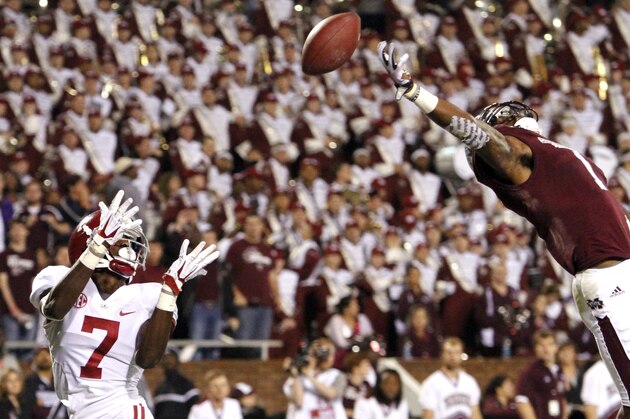 Mississippi State defensive back Nickoe Whitley (1) breaks up a pass intended for Alabama wide receiver Kenny Bell (7) in the end zone during the second half of an NCAA college football game on Saturday, Nov. 16, 2013, in Starkville, Miss. (AP Photo/Butch Dill)