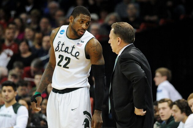 SPOKANE, WA - MARCH 22:  Head coach Tom Izzo talks to Branden Dawson #22 of the Michigan State Spartans in the first half against the Harvard Crimson during the Third Round of the 2014 NCAA Basketball Tournament at Spokane Veterans Memorial Arena on March 22, 2014 in Spokane, Washington.  (Photo by Steve Dykes/Getty Images)