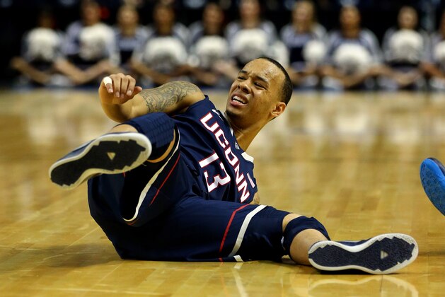 BUFFALO, NY - MARCH 22: Shabazz Napier #13 of the Connecticut Huskies falls down against the Villanova Wildcats during the third round of the 2014 NCAA Men's Basketball Tournament at the First Niagara Center on March 22, 2014 in Buffalo, New York.  (Photo by Elsa/Getty Images)