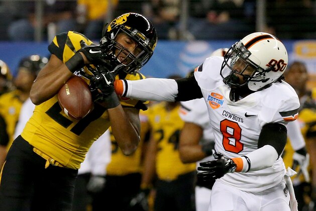 ARLINGTON, TX - JANUARY 03:  Wide receiver Bud Sasser #21 of the Missouri Tigers is unable to make a catch as it's broken up by Daytawion Lowe #8 of the Oklahoma State Cowboys in the first quarter during the AT&T Cotton Bowl on January 3, 2014 in Arlington, Texas.  (Photo by Ronald Martinez/Getty Images)