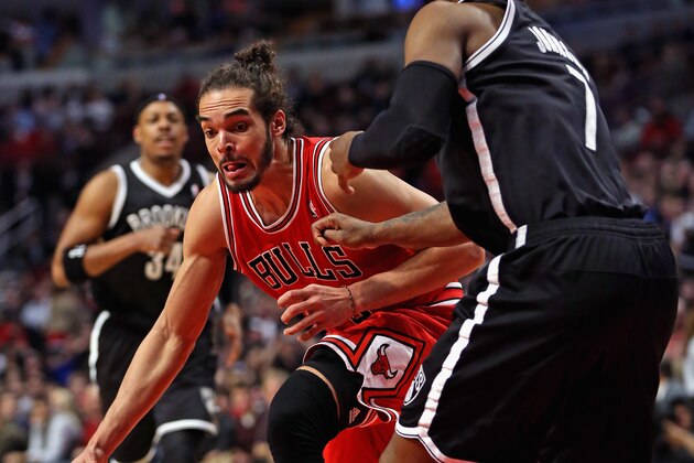 CHICAGO, IL - FEBRUARY 13:  Joakim Noah #13 of the Chicago Bulls moves against Joe Johnson #7 of the Brooklyn Nets at the United Center on February 13, 2014 in Chicago, Illinois. The Bulls defeated the Nets 92-76. NOTE TO USER: User expressly acknowledges and agrees that, by downloading and or using this photograph, User is consenting to the terms and conditions of the Getty Images License Agreement.  (Photo by Jonathan Daniel/Getty Images)
