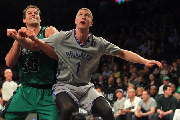 Mar 21, 2014; Brooklyn, NY, USA; Brooklyn Nets power forward Mason Plumlee (1) boxes out Boston Celtics center Kris Humphries (43) on a foul shot during the second quarter of a game at Barclays Center. Mandatory Credit: Brad Penner-USA TODAY Sports