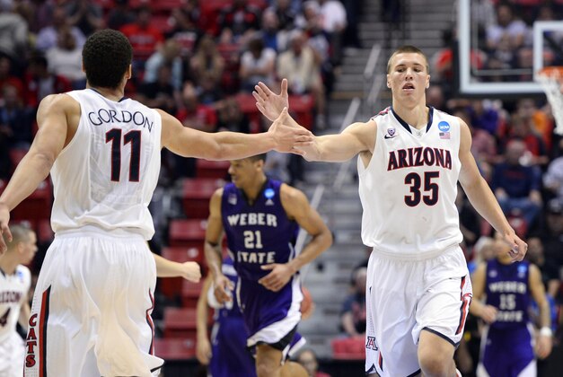 Mar 21, 2014; San Diego, CA, USA; Arizona Wildcats center Kaleb Tarczewski (35) celebrates with forward Aaron Gordon (11) in the second half of a men's college basketball game during the second round of the 2014 NCAA Tournament against the Weber State Wildcats at Viejas Arena. Mandatory Credit: Christopher Hanewinckel-USA TODAY Sports