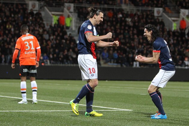 Paris Saint Germain's Zlatan Ibrahimovic, center, and Edison Cavanni, right, jubilate after the first goal during their French League one soccer match, in Lorient, western France, Friday, March 21, 2014. (AP Photo/David Vincent)
