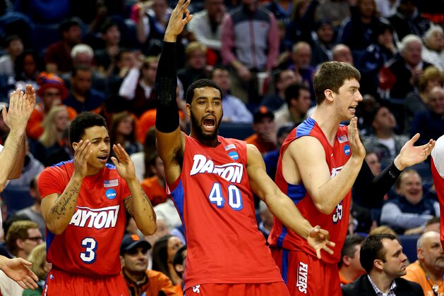 BUFFALO, NY - MARCH 22: Devon Scott #40 and Kyle Davis #3 of the Dayton Flyers react on the bench during the third round of the 2014 NCAA Men's Basketball Tournament against the Syracuse Orange at the First Niagara Center on March 22, 2014 in Buffalo, New York.  (Photo by Elsa/Getty Images)