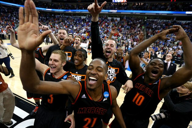 RALEIGH, NC - MARCH 21:  Kevin Canevari #3, Langston Hall #21 and Ike Nwamu #10 of the Mercer Bears celebrate the Bears 78-71  victory against the Duke Blue Devils in the second round of the 2014 NCAA Men's Basketball Tournament at PNC Arena on March 21, 2014 in Raleigh, North Carolina.  (Photo by Streeter Lecka/Getty Images)