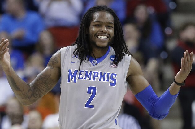 Memphis forward Shaq Goodwin (2) celebrates after the second half of an NCAA college basketball second-round tournament game against George Washington, Friday, March 21, 2014, in Raleigh. Memphis won 71-66. (AP Photo/Gerry Broome)