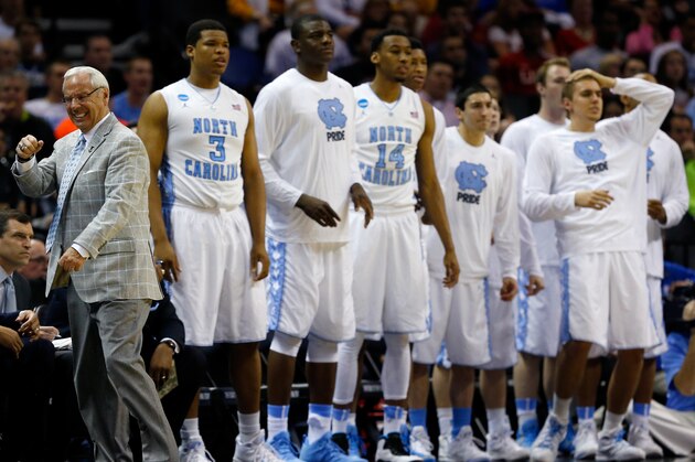 SAN ANTONIO, TX - MARCH 21: Head coach Roy Williams of the North Carolina Tar Heels reacts to a play in the second half against the Providence Friars during the second round of the 2014 NCAA Men's Basketball Tournament at AT&T Center on March 21, 2014 in San Antonio, Texas.  (Photo by Tom Pennington/Getty Images)