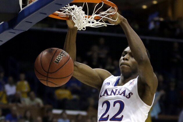 Kansas' Andrew Wiggins dunks the ball during the second half of a second-round game against Eastern Kentucky in the NCAA college basketball tournament Friday, March 21, 2014, in St. Louis. Kansas won 80-69. (AP Photo/Jeff Roberson)