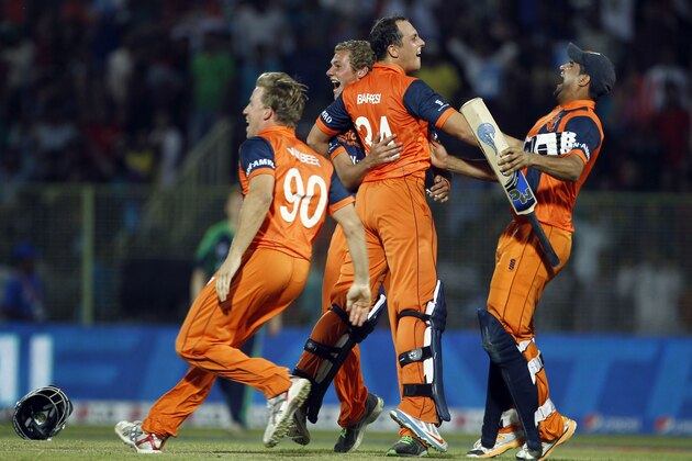 Netherlands' players celebrate their win against Ireland during the ICC Twenty20 Cricket World Cup match in Sylhet, Bangladesh, Friday, March 21, 2014. (AP Photo/A.M. Ahad)