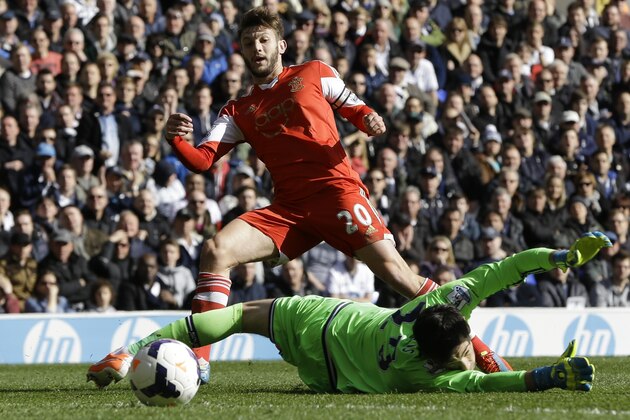 Southampton's Adam Lallana scores a goal past Tottenham's Hugo Lloris during the English Premier League soccer match between Tottenham Hotspur and Southampton at White Hart Lane stadium in London, Sunday, March 23, 2014. (AP Photo/Kirsty Wigglesworth)