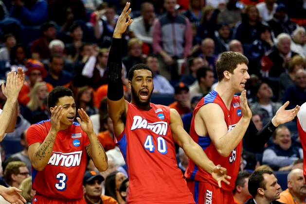 BUFFALO, NY - MARCH 22: Devon Scott #40 and Kyle Davis #3 of the Dayton Flyers react on the bench during the third round of the 2014 NCAA Men's Basketball Tournament against the Syracuse Orange at the First Niagara Center on March 22, 2014 in Buffalo, New York.  (Photo by Elsa/Getty Images)