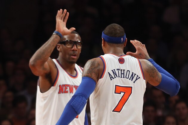 NEW YORK, NY - JANUARY 03: Amar'e Stoudemire #1 and Carmelo Anthony #7 of the New York Knicks celebrate a basket late in the game against the San Antonio Spurs at Madison Square Garden on January 3, 2013 in New York City. NOTE TO USER: User expressly acknowledges and agrees that, by downloading and/or using this photograph, user is consenting to the terms and conditions of the Getty Images License Agreement. The Knicks fdefeated the Spurs 100-83. (Photo by Bruce Bennett/Getty Images)