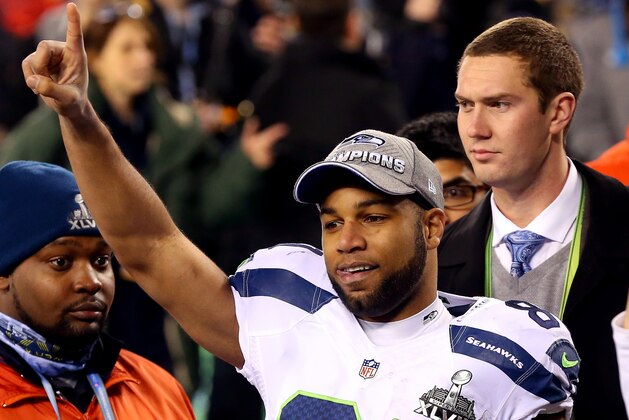 EAST RUTHERFORD, NJ - FEBRUARY 02:  Wide receiver Golden Tate #81 of the Seattle Seahawks celebrates their 43-8 victory over the Denver Broncos during Super Bowl XLVIII at MetLife Stadium on February 2, 2014 in East Rutherford, New Jersey.  (Photo by Ronald Martinez/Getty Images)