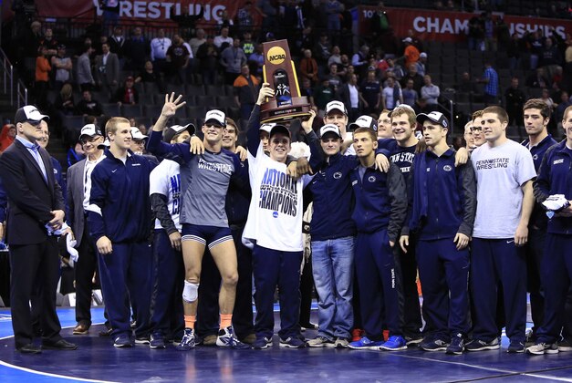 Mar 22, 2014; Oklahoma City, OK, USA; Penn State holds up the team championship trophy after winning the NCAA wrestling Division I championship at Chesapeake Energy Arena. Mandatory Credit: Alonzo Adams-USA TODAY Sports
