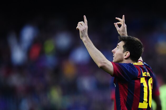FC Barcelona's Lionel Messi, celebrates after scoring during the Spanish La Liga soccer match between FC Barcelona and Osasuna at the Camp Nou stadium in Barcelona, Spain, Sunday, March 16, 2014. (AP Photo/Manu Fernandez)