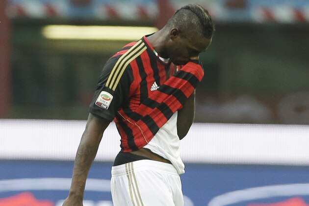 AC Milan forward Mario Balotelli walks off the field at the end of a Serie A soccer match between AC Milan and Parma, at the San Siro stadium in Milan, Italy, Sunday, March 16, 2014. Parma won 4-2. (AP Photo/Luca Bruno)