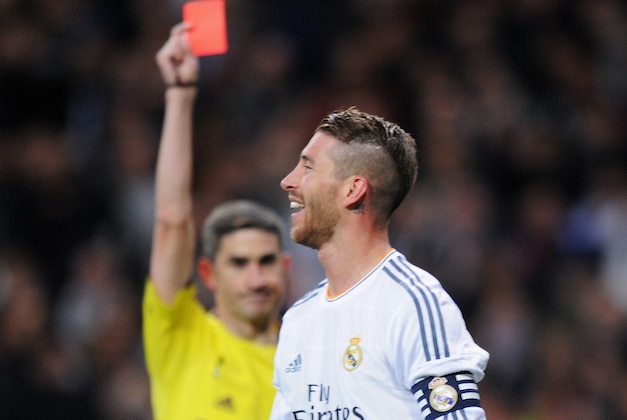 MADRID, SPAIN - MARCH 23: Sergio Ramos of Real Madrid is shown the red card by referee Alberto Undiano Mallenco during the La Liga match between Real Madrid CF and FC Barcelona at the Bernabeu on March 23, 2014 in Madrid, Spain.  (Photo by Denis Doyle/Getty Images)