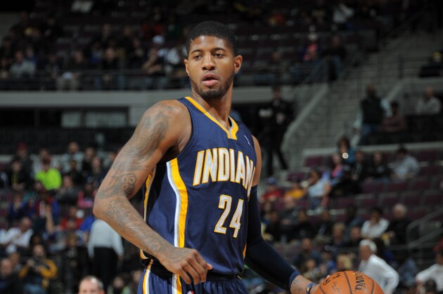 AUBURN HILLS, MI - MARCH 15: Paul George #24 of the Indiana Pacers looks to pass the ball against the Detroit Pistons during the game on March 15, 2014 at The Palace of Auburn Hills in Auburn Hills, Michigan. NOTE TO USER: User expressly acknowledges and agrees that, by downloading and/or using this photograph, User is consenting to the terms and conditions of the Getty Images License Agreement.  Mandatory Copyright Notice: Copyright 2014 NBAE (Photo by Allen Einstein/NBAE via Getty Images)