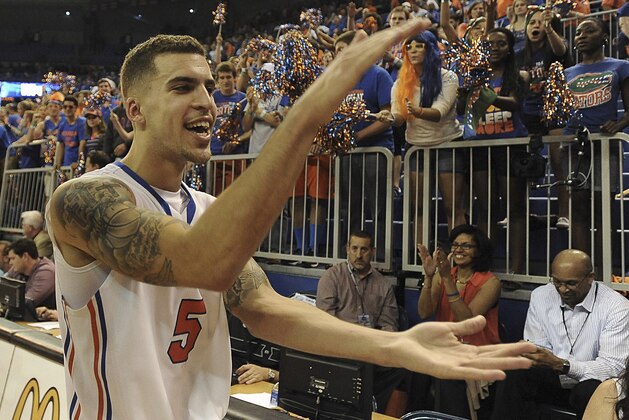 Florida guard Scottie Wilbekin (5) does the gator chomp as he leaves the court after Florida defeated LSU 79-61 in an NCAA college basketball game Saturday, March 1, 2014 in Gainesville, Fla. (AP Photo/Phil Sandlin) Florida guard Scottie Wilbekin (5) does the gator chomp as he leaves the court after Florida defeated LSU 79-61 in an NCAA college basketball game Saturday, March 1, 2014 in Gainesville, Fla. (AP Photo/Phil Sandlin)