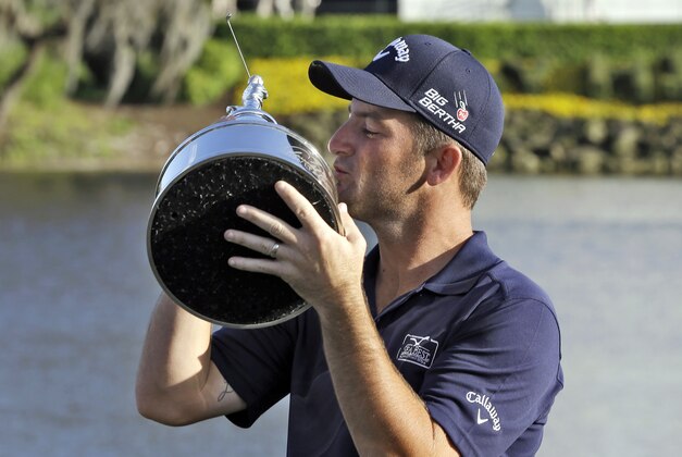 Matt Every kisses the trophy after winning the Arnold Palmer Invitational golf tournament at Bay Hill, Sunday, March 23, 2014, in Orlando, Fla. (AP Photo/Chris O'Meara)