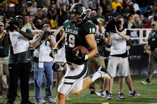 Sep 15, 2012; Waco, TX, USA; Baylor Bears tight end Jordan Najvar (18) scores a touchdown against the Sam Houston State Bearkats during the third quarter at Floyd Casey Stadium. The Bears defeated the Bearkats 43-28. Mandatory Credit: Jerome Miron-USA TODAY Sports