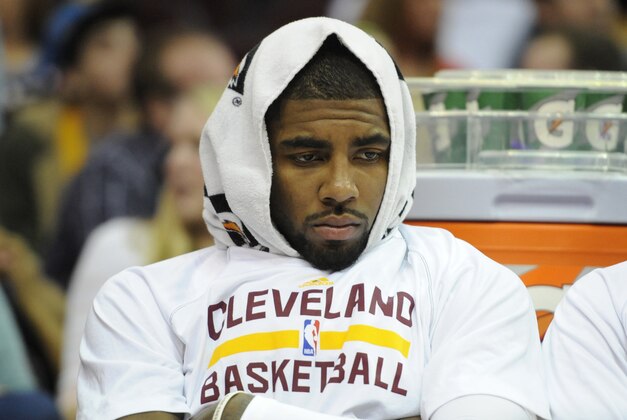 Feb 5, 2014; Cleveland, OH, USA; Cleveland Cavaliers point guard Kyrie Irving sits on the bench in the third quarter against the Los Angeles Lakers at Quicken Loans Arena. Mandatory Credit: David Richard-USA TODAY Sports